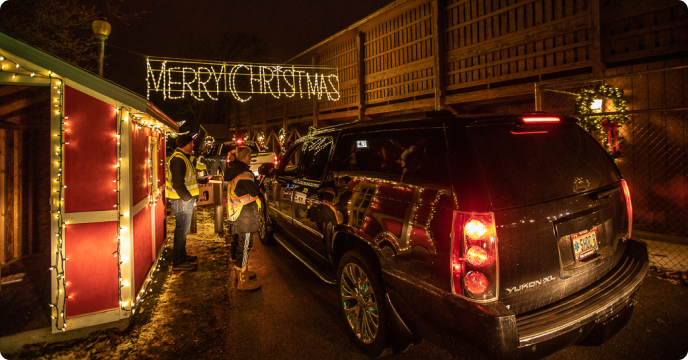 Car driving through holiday lights display