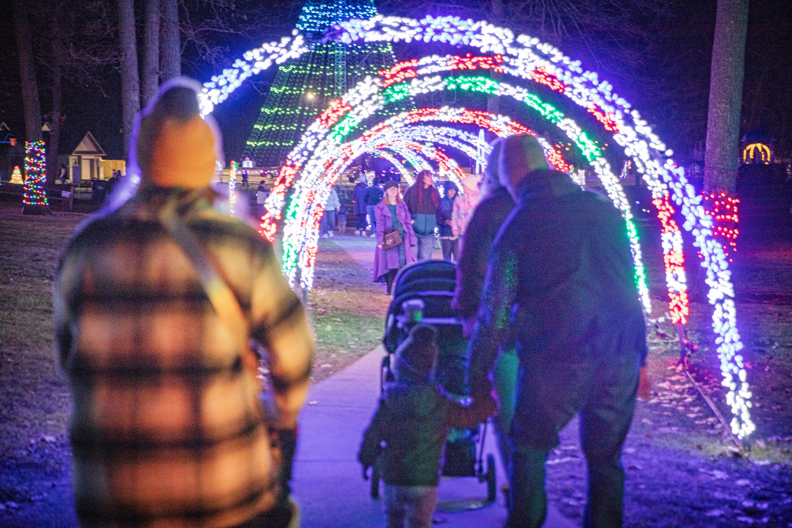 People walking through the light tunnel