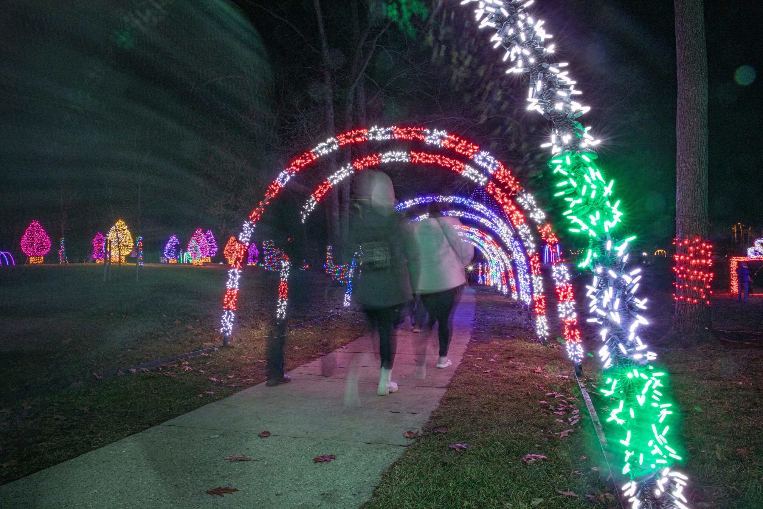 People walking through the light tunnel