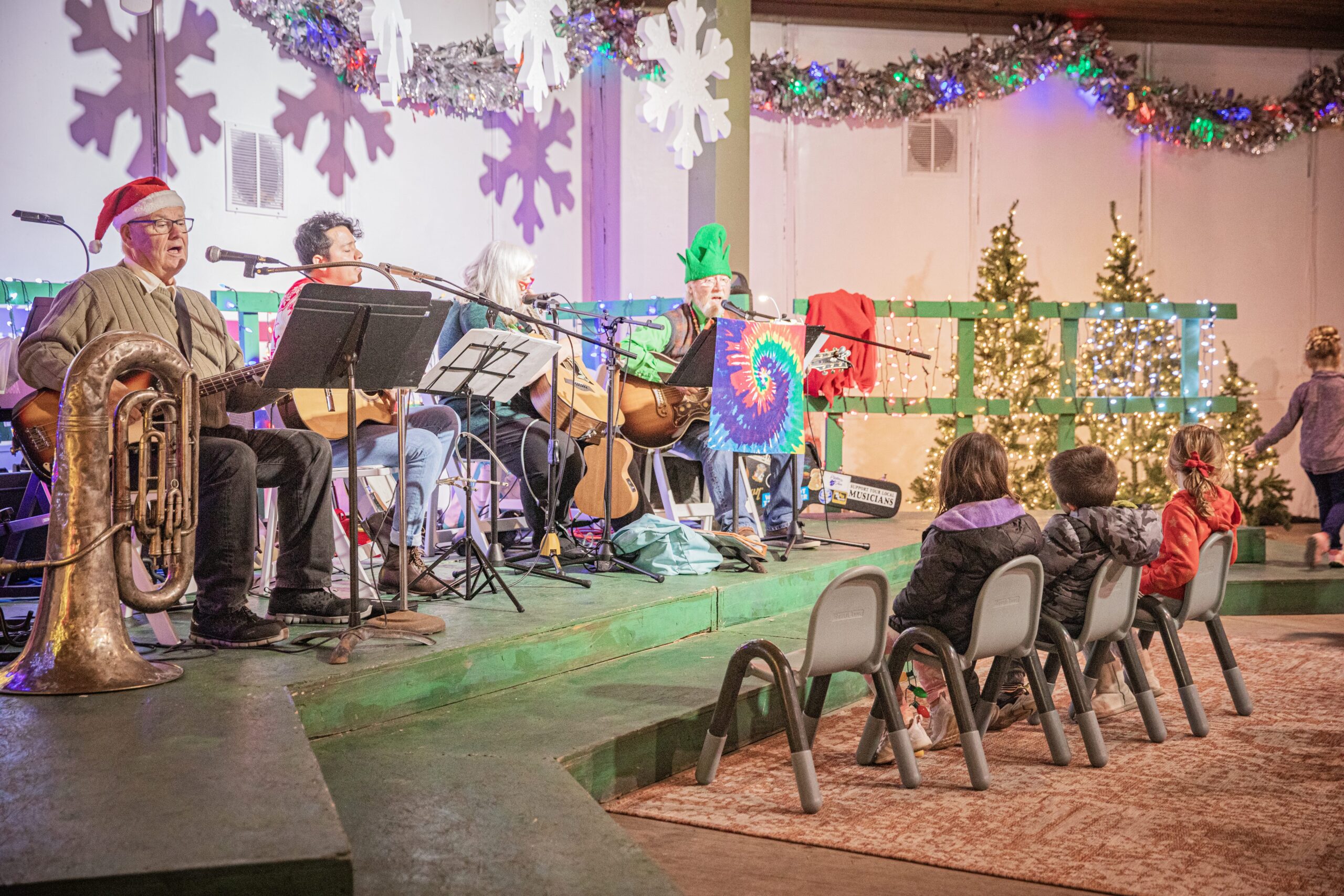 Musicians sitting on a stage